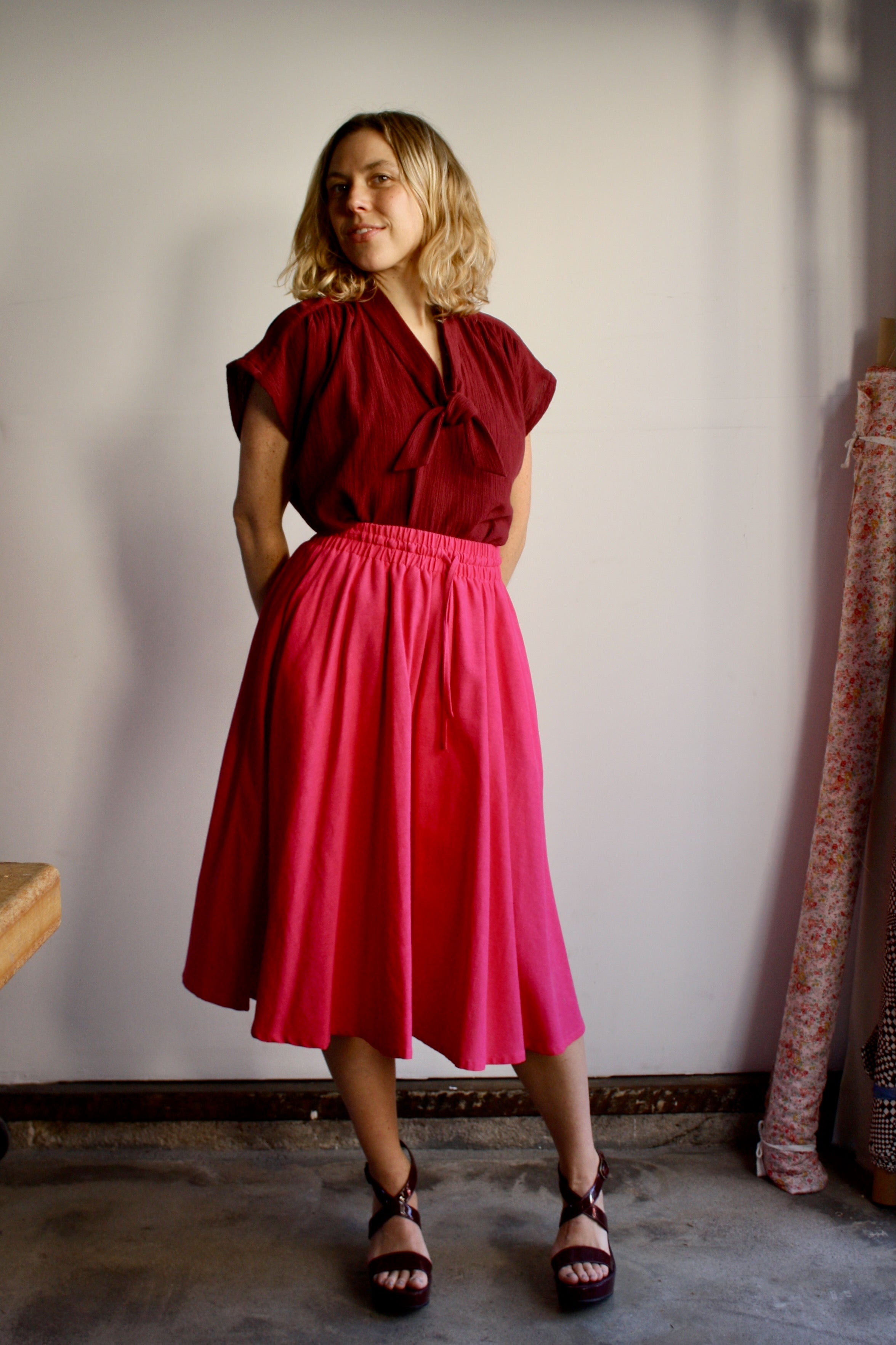 Myrtle Faye blouse in burgundy blossom styled with Ella skirt in hot pink
