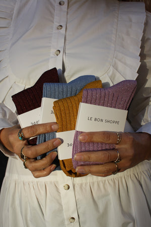 Le Bon Shoppe glitter socks; assorted colors held by model